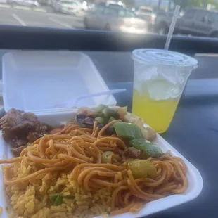 a plate of noodles, meat, and a drink