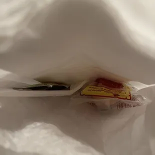 Utensil, fortune cookie and soy sauce- you can get more upon request