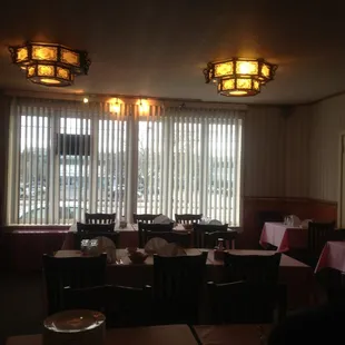 a dining room with tables and chairs