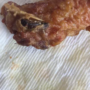 Picture #2 Don't eat At Chinese Delight there are 3 bugs in this one pieces of chicken.