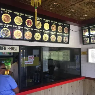 a woman standing in front of the counter