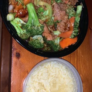 a bowl of rice and a bowl of broccoli