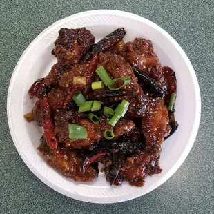 a plate of food with meat and vegetables