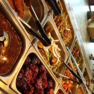 a variety of dishes in a buffet