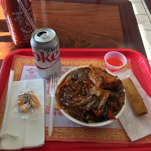 egg fry rice bowl topped with eggplant tofu stirfry, spring roll, fortune cookie and Diet Coke
