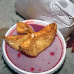 A crab cheese wonton / crab ragoon from Chinese Gourmet (on the sweet &amp; sour sauce).