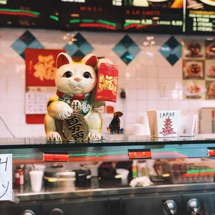 a cat figurine at a restaurant