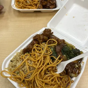 two take out containers of food
