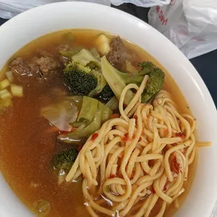 Spicy noodle soup: with beef $8-9. If Chow mein and broccoli beef inter-married and swam in a spicy broth.