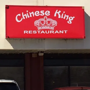 cars parked in front of a chinese restaurant