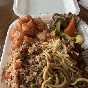 Combination plate, orange chicken, broccoli, beef, and teriyaki chicken with half-and-half fried rice chow mein.