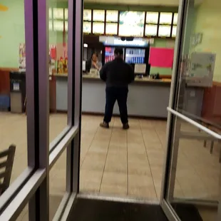 a man standing at the counter