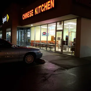 a car parked in front of a chinese kitchen