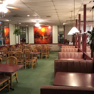 a restaurant with tables and chairs