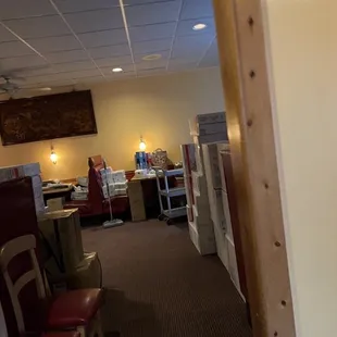 Dining Room - One Side for Dining, and I guess the other for storage? Not a good look.