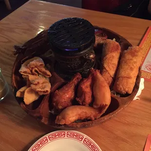 This was out appetizer sampler and it was amazing!! The grill in the center was actually lit on fire.