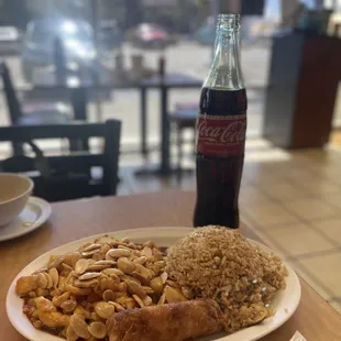 a plate of food and a coke