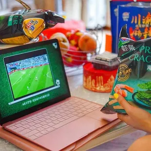 a person playing a game on a laptop