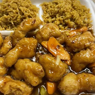 chicken, rice, and vegetables in a styrofoam container