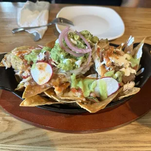 Super nachos, with chicken. Usually birria but we substituted