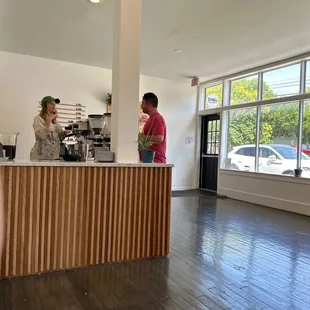 two people standing at a counter