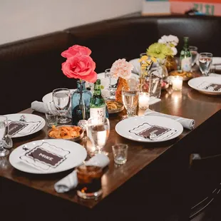 a table set with plates and glasses