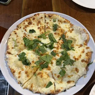 White pizza: ricotta, mozzarella, spinach, roasted garlic.