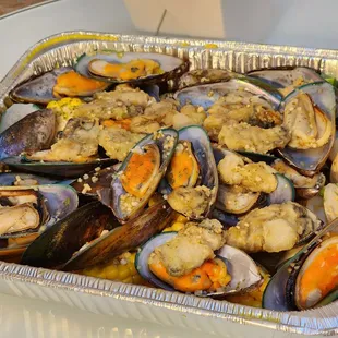 Mussels, clam, fried oysters, potato, and corn from chile crab