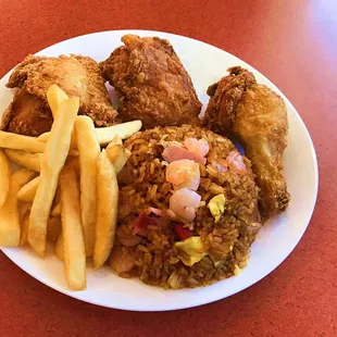 a plate of fried chicken and french fries