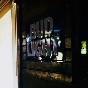 a sign that reads bud light