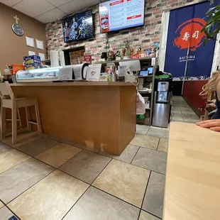 a woman sitting at a counter