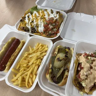 Carne asada nachos, plain hot dog and fries, Aztec hot dog and shrimp taco!