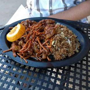 Orange chicken and fried rice. Much better than usual Chinese food places. Delicious!