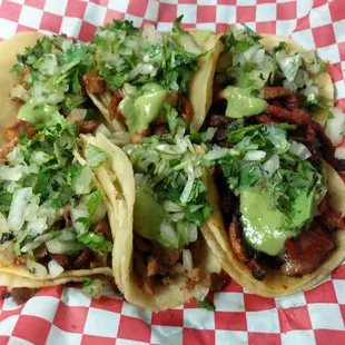 three tacoss in a basket