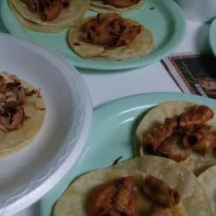 a variety of tacoss on plates