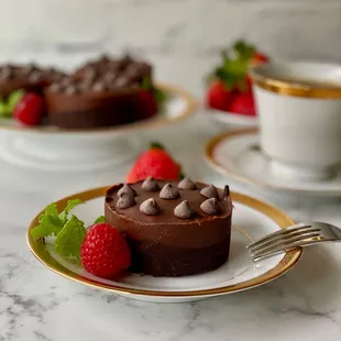 a chocolate cake with strawberries on a plate