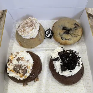 four different types of cookies in a box