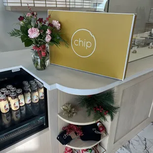 Christmas decorations and Starbucks, Frappuccinos next to check out counter.