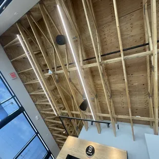 a view of a ceiling with wooden beams