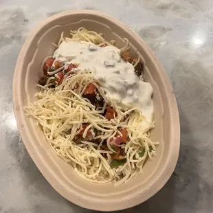 This is a rice bowl with chicken.