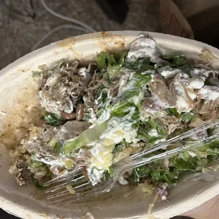 This is the bowl that I had reserved it has pork tons of sour cream lettuce pinto beans rice none of the stuff I asked for