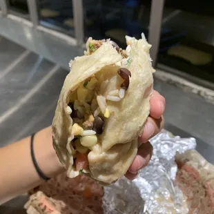 shouldnt an employee know how to properly roll a burrito so this doesnt happen? TERRIBLE service at this Chipotle!