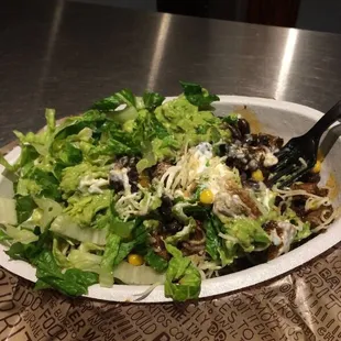 Brown rice, black beans, grilled chicken, sour cream, cheese, corn, avocado and lettuce... Delicious.