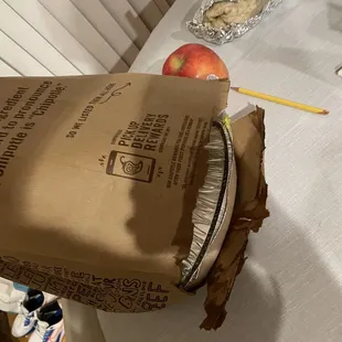 Hole in the bottom of the bag from the leaking buritto