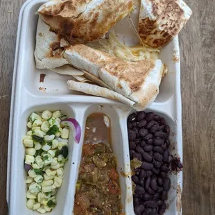 A "quesadilla". Half of it barely had any chicken. Must've been smashed with a hammer. Most likely spit on. And then punched a few times.