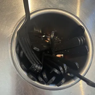 Forks soaking in sticky sugary drink