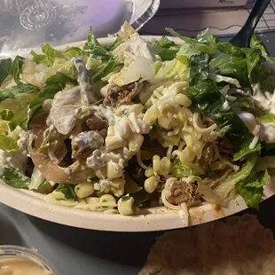 Online Order, Chicken + Carnitas, Corn Salsa, Lettuce, Cheese, Fajitas, White Rice and Pinto Beans