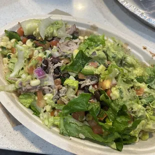 Bowl with white rice beans, carnitas, pico, corn, salad and quac SUCH SMALL PORTIONS I just opened this