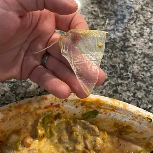 Plastic glove/food wrap piece in food