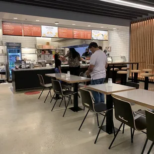 a restaurant with tables and chairs